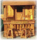 lemonade stand on backyard lower cabin playset with kids stools and lemonade sign