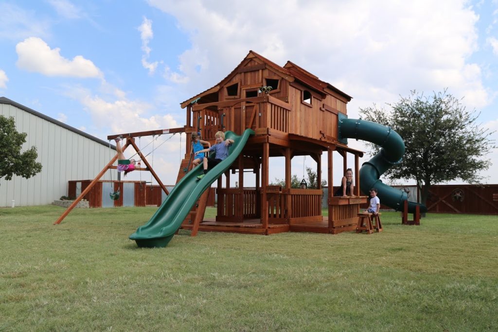 Spring, Texas, Ticonderoga Tri-Level, redwood wooden forts, twister slide, swings, rave slide, and rock wall