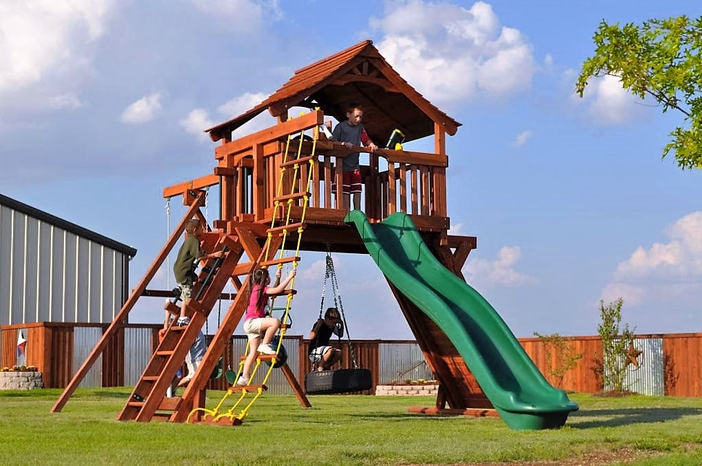 7' deck height, ranger play set, fort, rope ladder, rock wall, rave slide, tire swing, belt swing, trapeze bar, water cannon