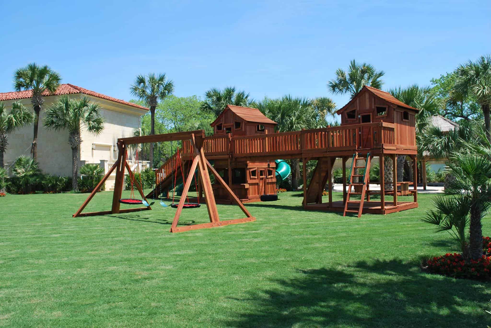 Shreveport, Louisiana, bridged ticonderoga redwood playsets with lemonade stand, picnic table, cabins, ramps, boardwalk, and slides