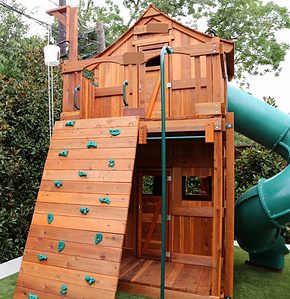 fort stockton playset with cabin and spiral slide in small space