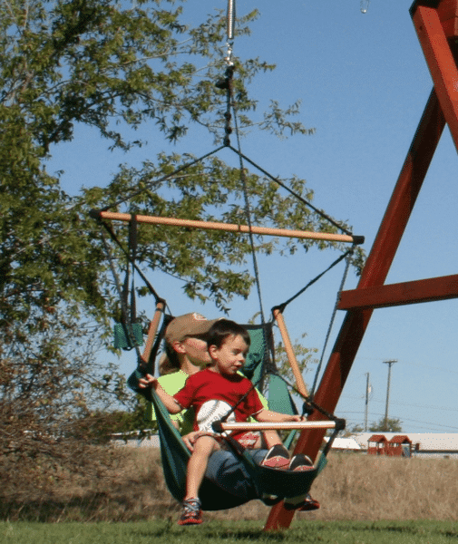 swings are for everyone, air chair is shown with an adult and child swinging on a kids outdoor playset