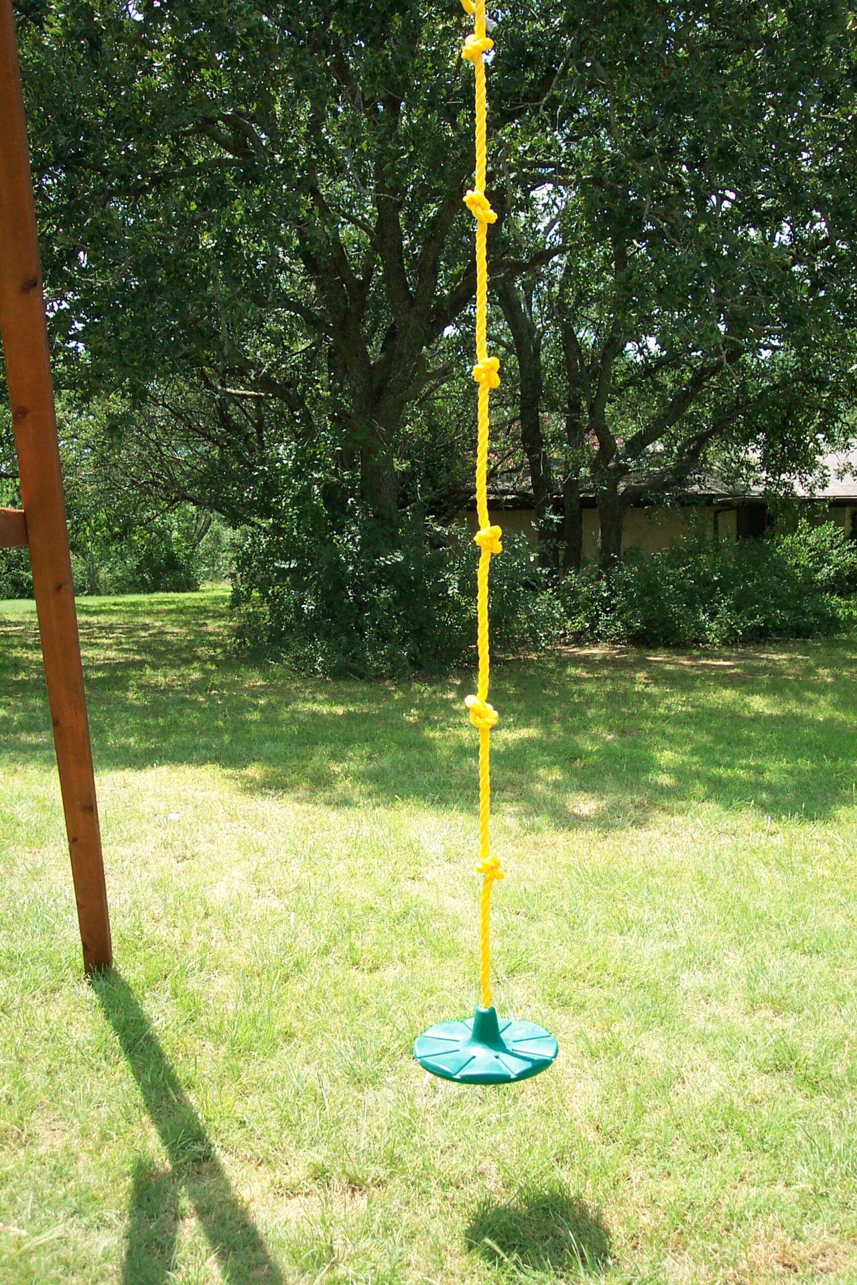 daisy disk swing has a green disk and a knotted rope, fits in a swing position on your wooden swing set, dallas