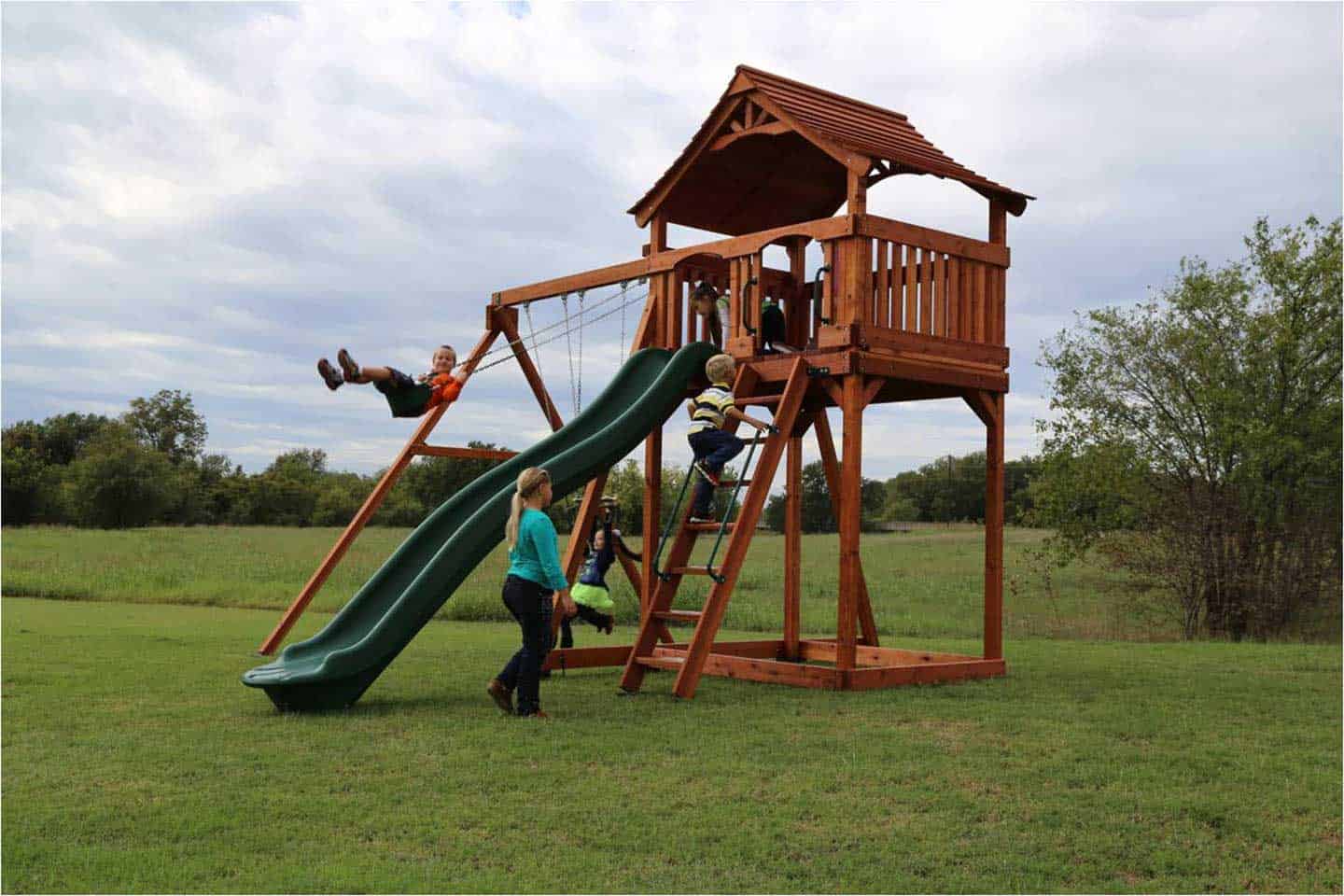 fort stockton swing set with open slat fort, avalanche slide, swings, and ladder