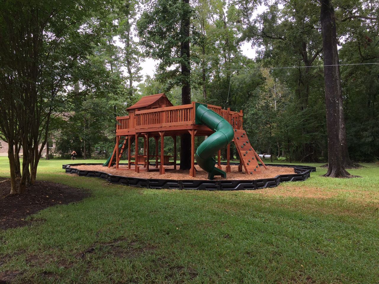 kids fort with tree deck, North Richland Hills, Texas, fort with tree deck, Fort Stockton swing set, spiral tube slide, picnic table and zip line.