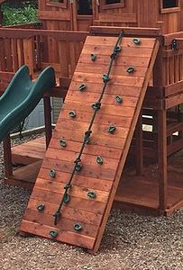 extended rock wall next level playset option to challenge older kids