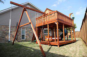 FORT WORTH, wooden playset, childrens playground, swings, spiral slide, and rock wall climber