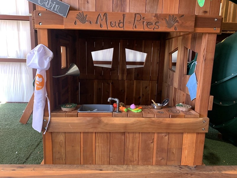 mud kitchen playset addition shown in our White Settlement Swing Set Showroom