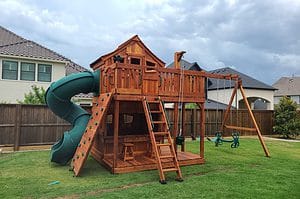 Flower Mound, fort stockton playset with lemonade counter, spiral slide, swings, lower cabin and upper cabin. catalog