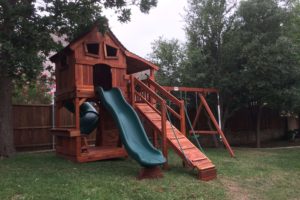 Allen Texas wooden swing set with slides and ramp