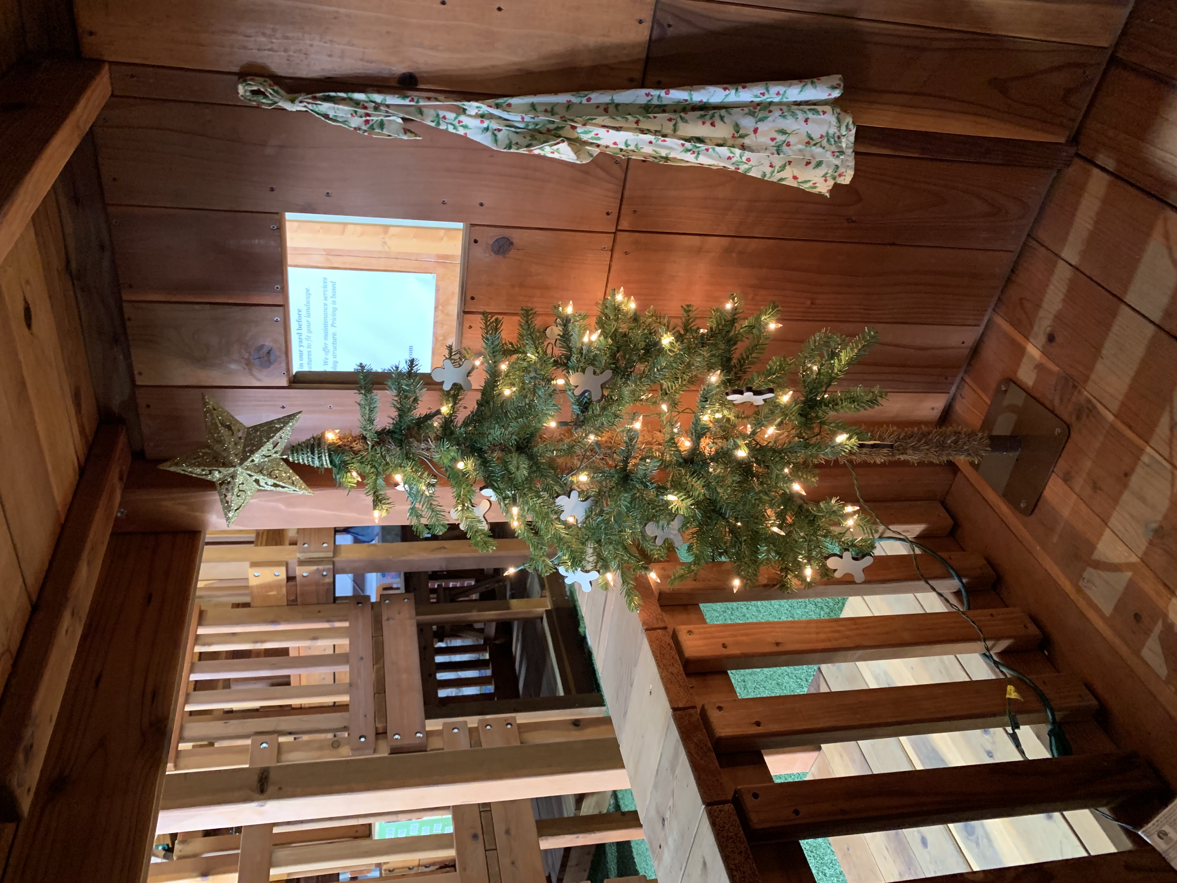 christmas tree in kids lower cabin swing set display in fort worth showroom