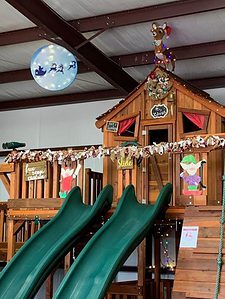 Ticonderoga swing set decorated for Christmas in fort worth showroom