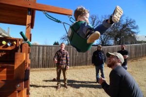 accessories toddler swinging on the toddler trainer playset with family