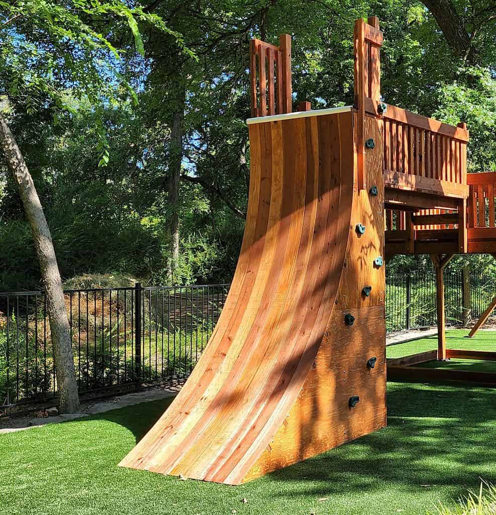 A warp wall accessory shown on a custom backyard playset.