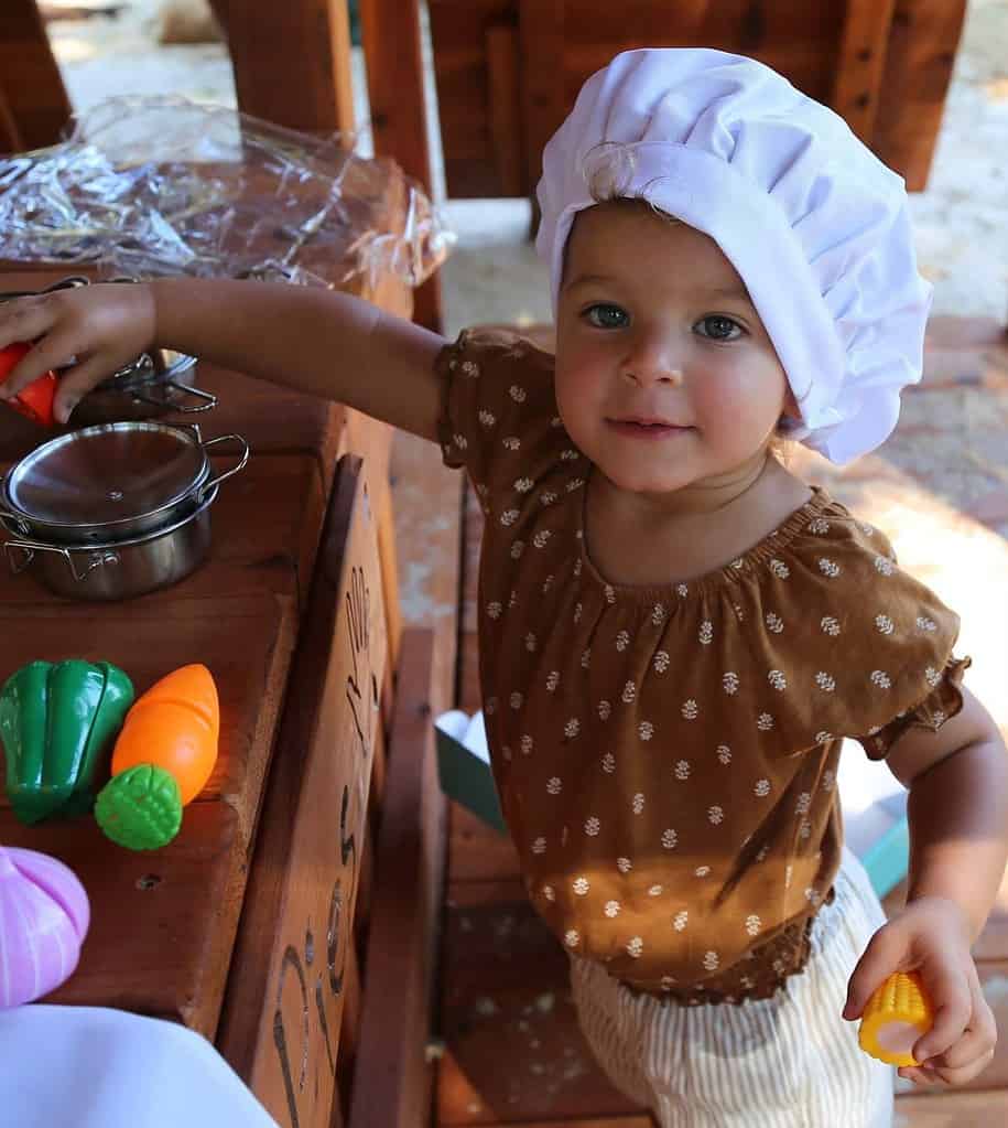 playset photo gallery, haltom city, texas, additions - swing set components -little toddler girl playing kitchen with the mud kitchen accessories and play foord