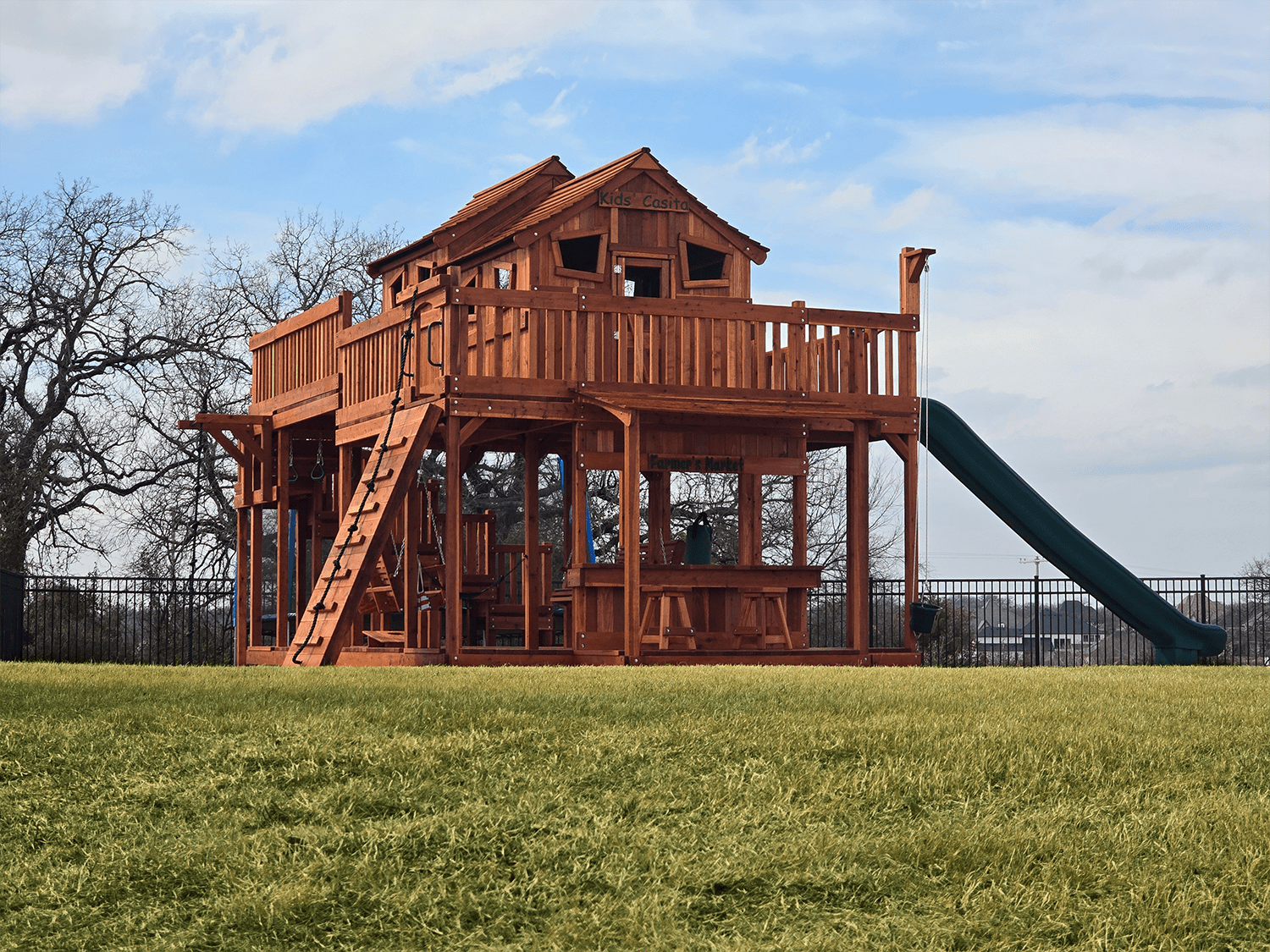 wooden swingset, ticonderoga with upper cabin and look out shack with upper cabin surround deck, slide and climber accessory