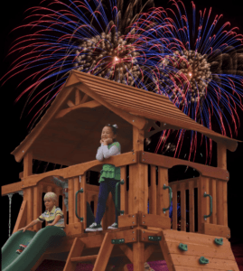 Kids ringing in the new year on their Backyard Fun Factory playset.