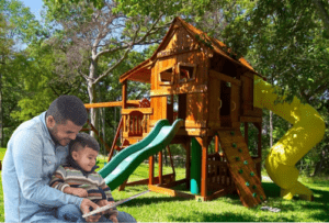 Family enjoying their backyard and their Backyard Fun Factory playset.