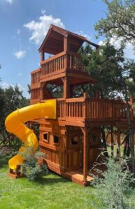 Unique tall playset built for a unique backyard landscape.