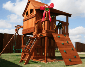 A redwood playset with a big Christmas bow makes an incredible gift.