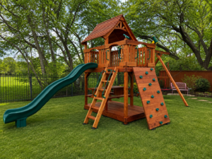 A redwood playset sits beautifully in a country home's backyard.Fort Davis custom California redwood swing set by Backyard Fun Factory in Argyle, Texas, featuring a rock wall, wave slide, upper clubhouse, deck ladder, and swing beam. Designed for growing families seeking a durable backyard playset that encourages climbing, active play, and imagination.