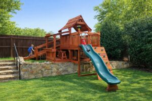 Children joyfully playing in their unique Backyard Fun Factory playset.