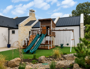 Custom Modern Design California redwood playset in Keller, Texas by Backyard Fun Factory featuring a modern upper cabin, wrap around Fun Deck, dual wave slides, platform steps, toddler swing, belt swing, adult porch swing, and professional installation for families throughout Keller and Tarrant County.